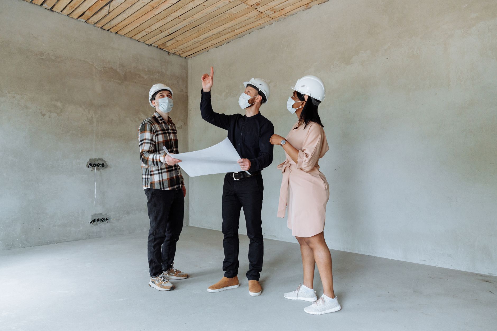 construction site with project manager reviewing safety planning checklist