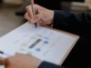 Construction project manager reviewing schedule baseline for commercial building